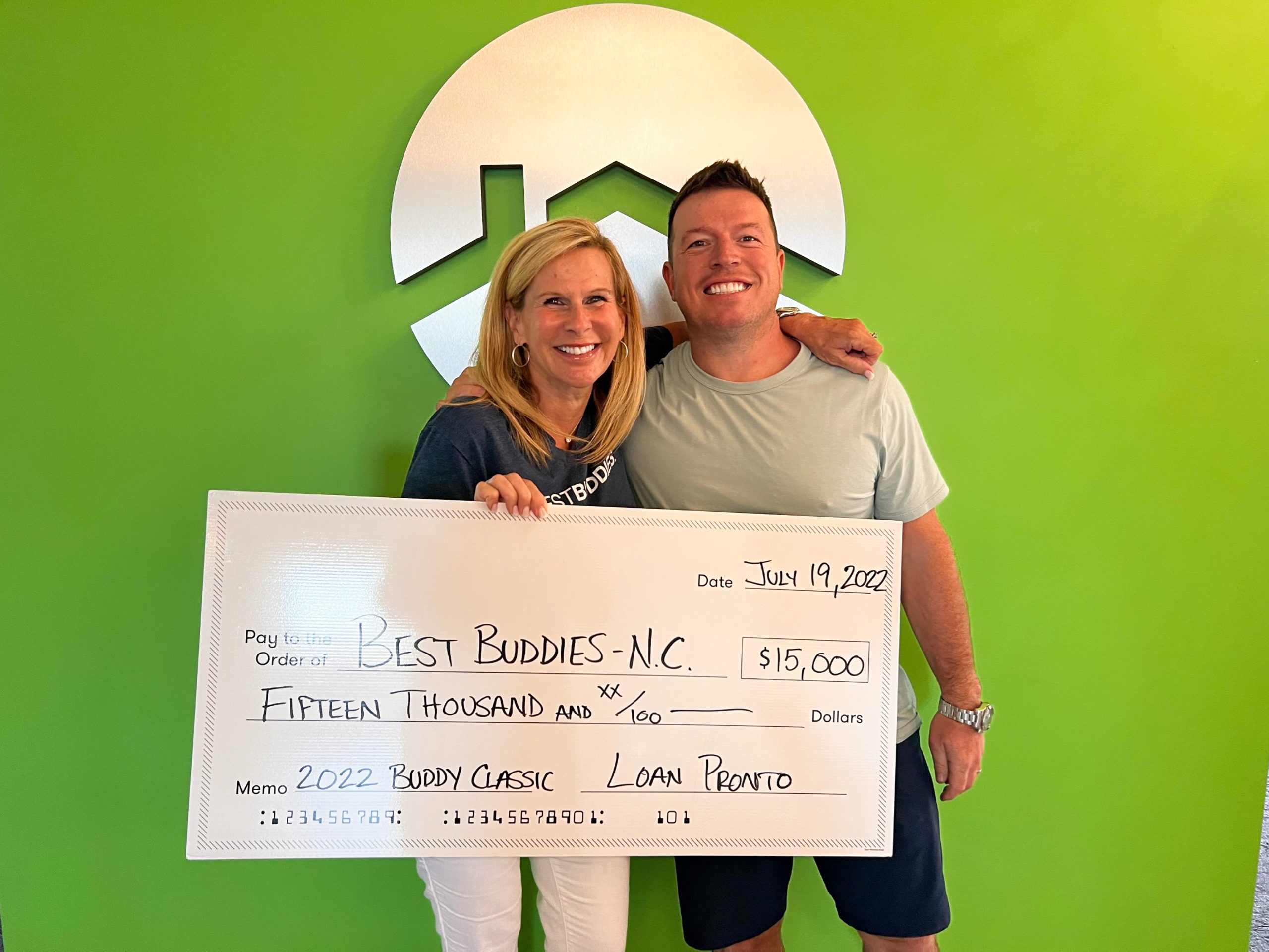 Roger Moore, President and Founder of Loan Pronto, with Tammy Medlock, State Director at Best Buddies in North Carolina.
