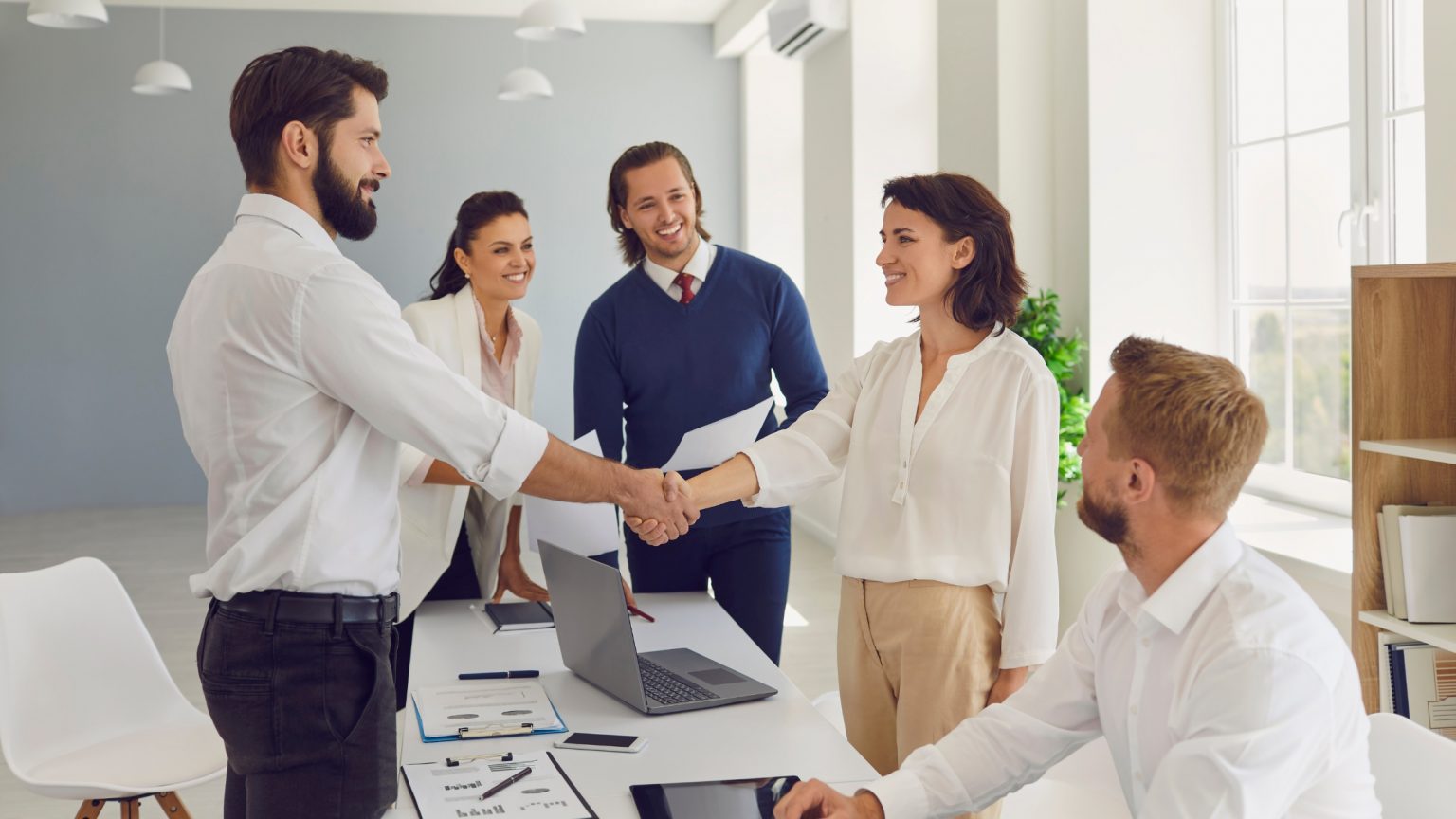 Hiring Loan Officers, shaking hands.