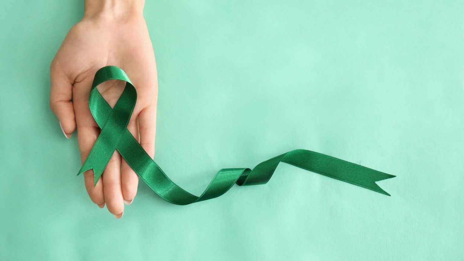 Mental Health Awareness Month green ribbon.