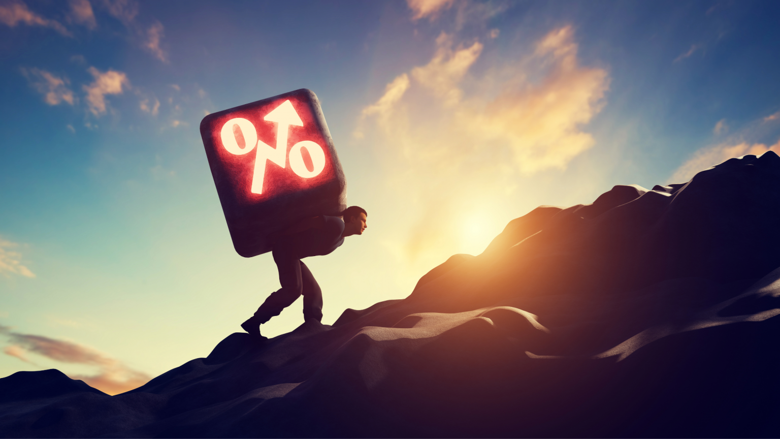 Man climbing up a steep mountain with interest rate percentage (%) symbol on his back.